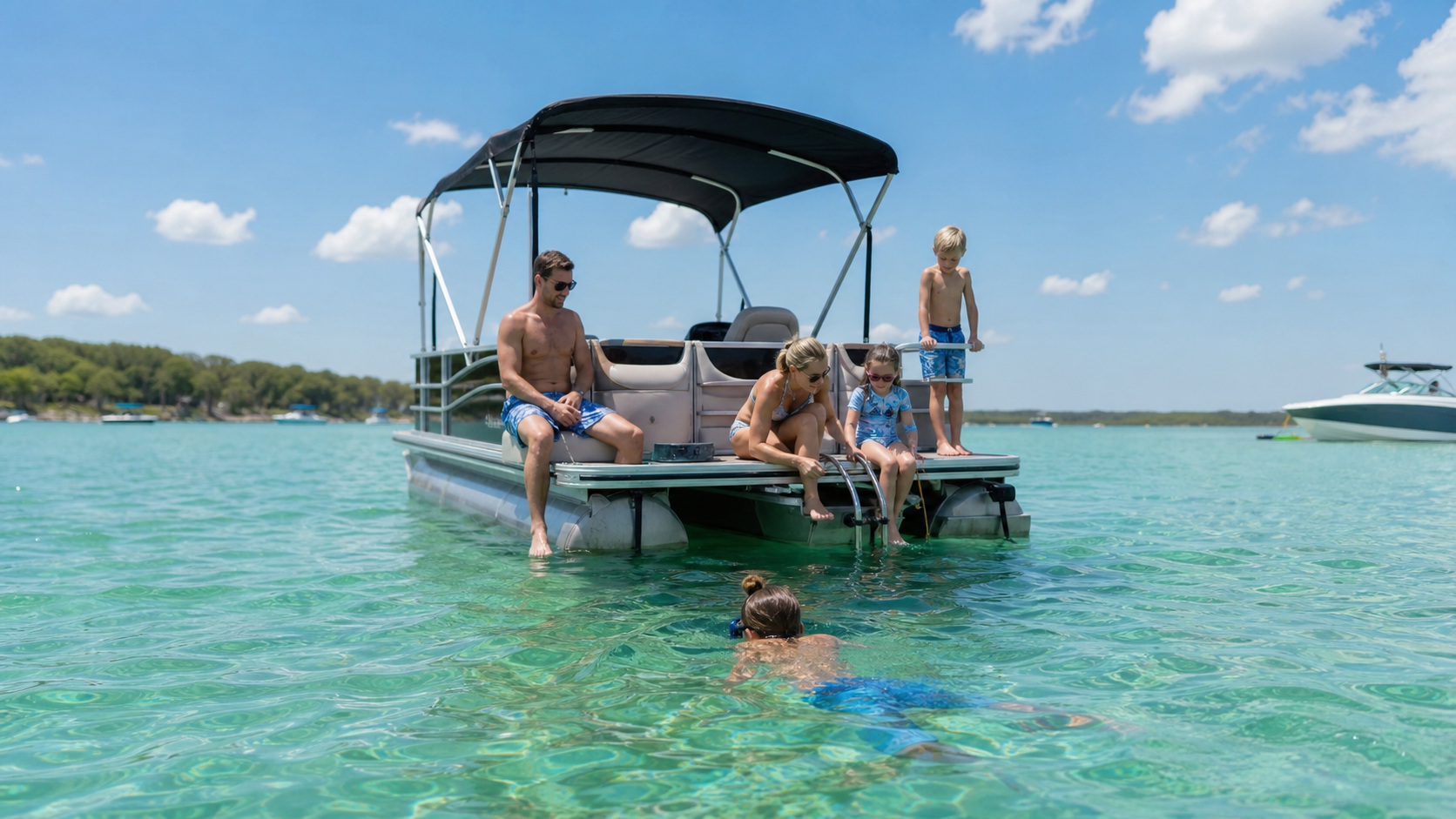 Group of friends relaxing on a rented pontoon boat anchored at Crab Island in Destin Florida with people swimming in crystal-clear shallow emerald water, other boats visible in the background