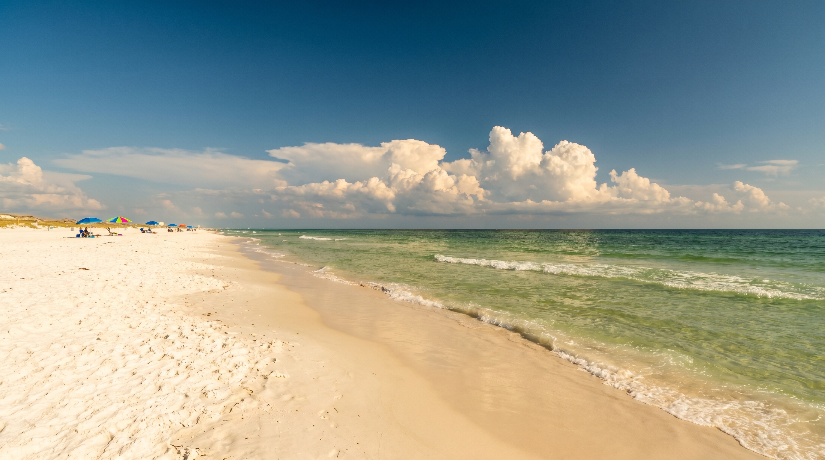 Warm sunny beach day in Destin Florida in September with clear blue skies and emerald Gulf water