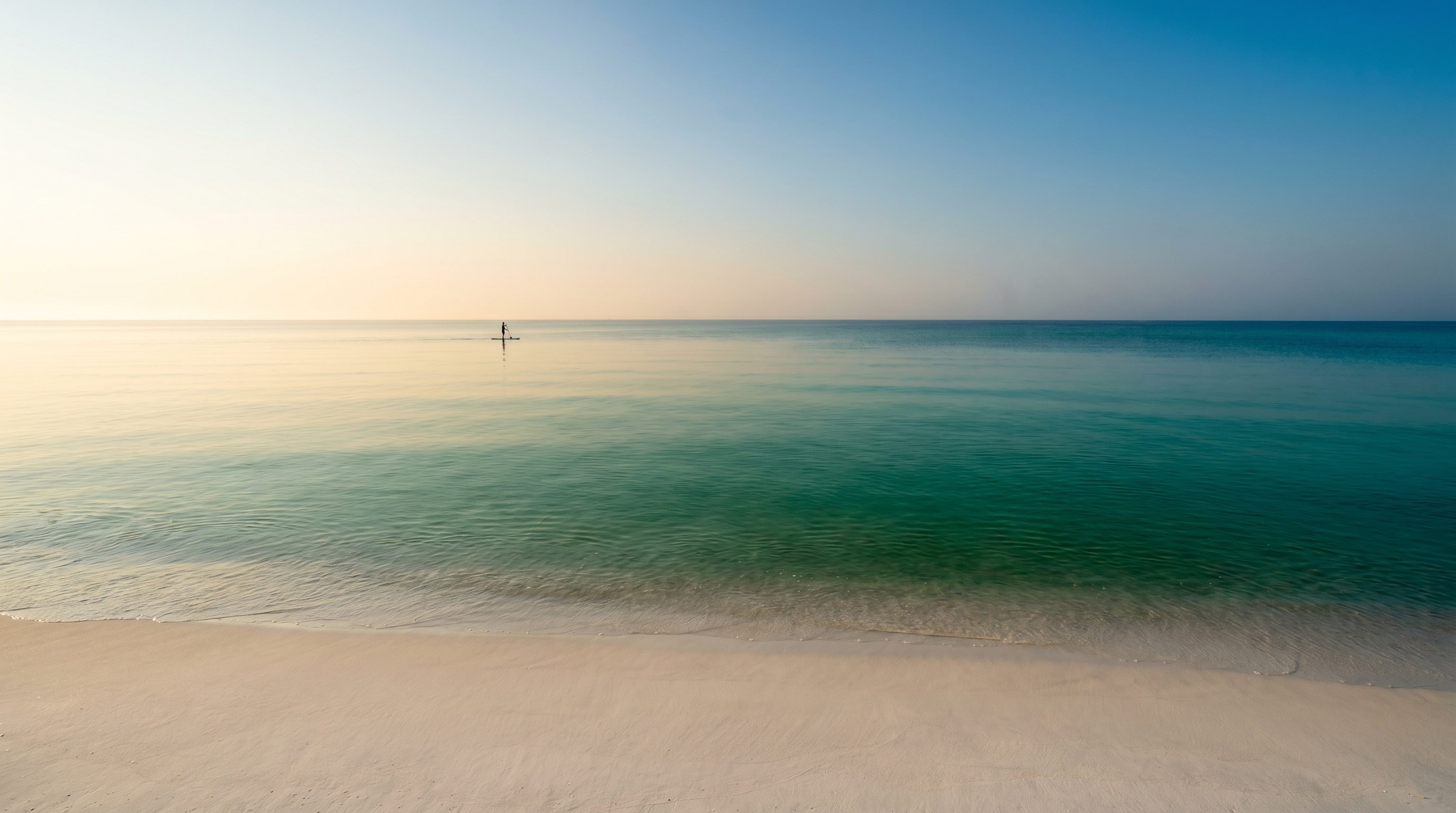 Crystal clear emerald green Gulf water on a calm June morning in Destin Florida perfect for snorkeling