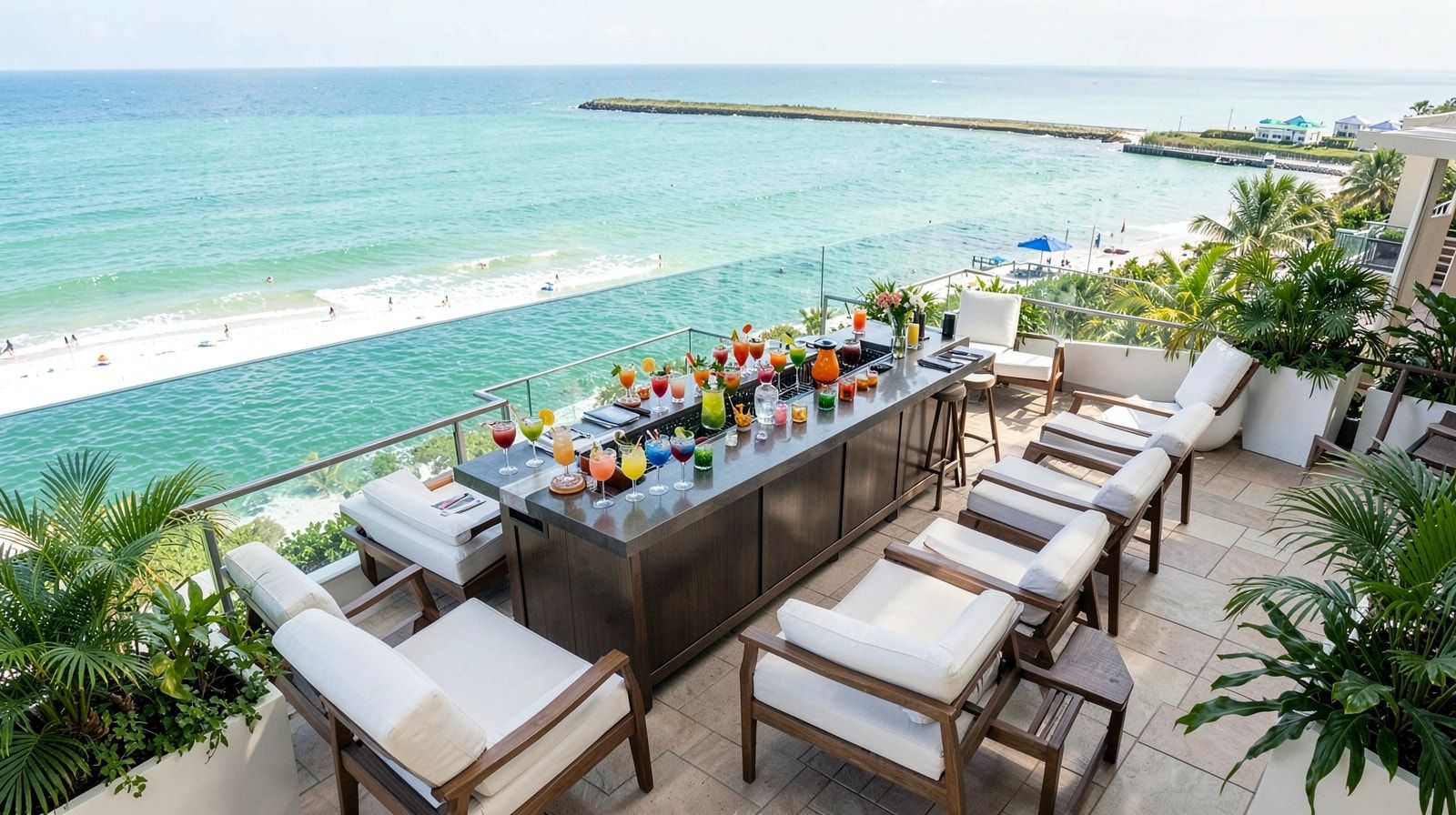 Upscale resort pool terrace bar overlooking the emerald Gulf of Mexico with cocktails and lounge chairs
