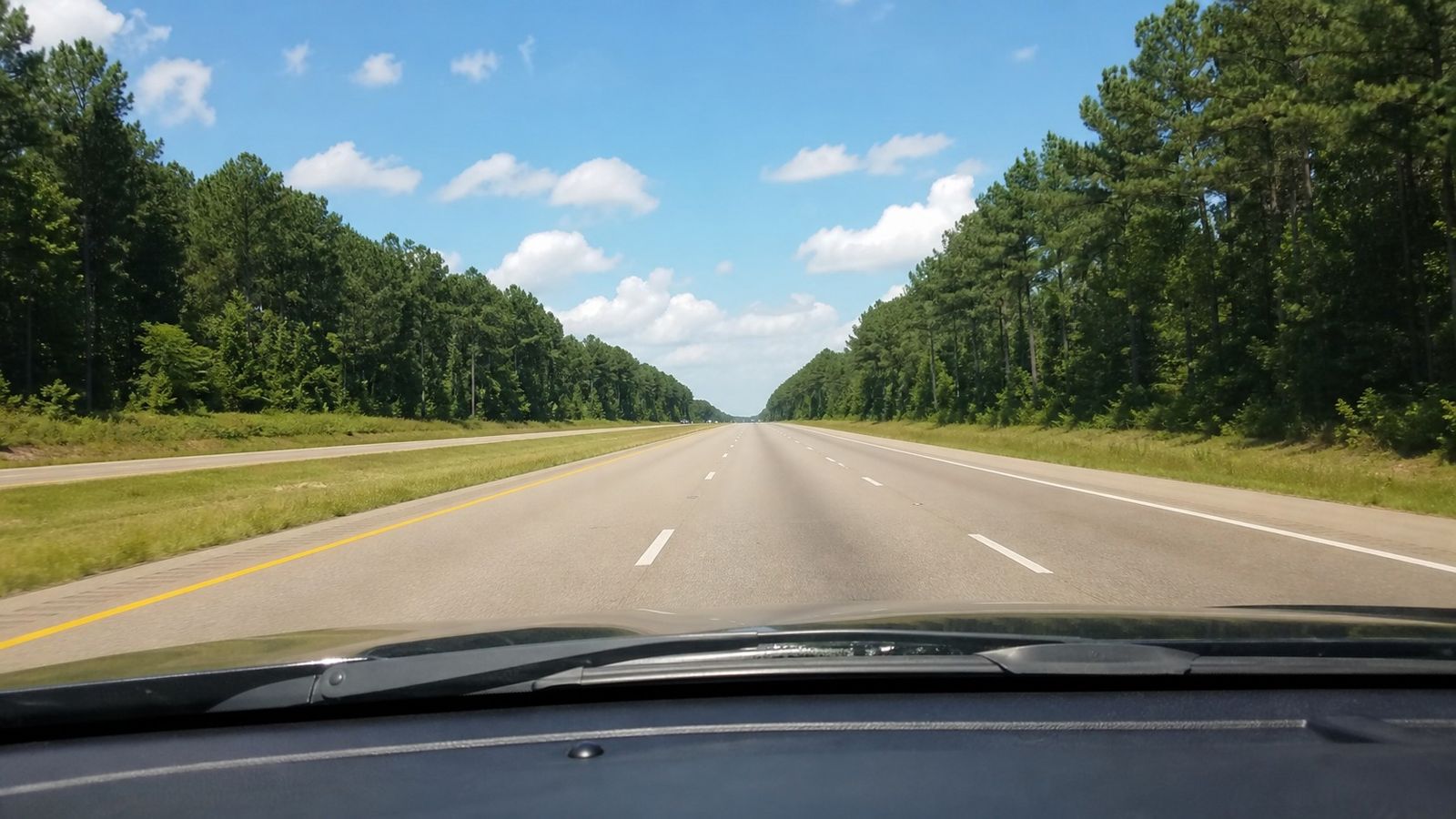 Driver's view through the windshield heading south on I-65 through central Alabama on the way to Destin Florida